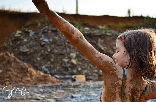 Muddy kid dancing