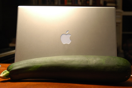 Zucchini beside Macbook Pro
